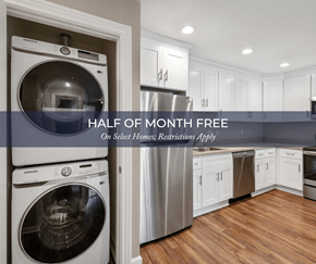 Castro Valley apartment for rent - a white and gray laundry room with a washer and dryer and white cabinets