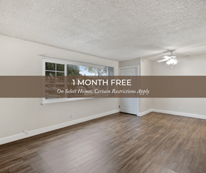 Fremont apartment for rent - an empty room with hardwood floors and a large window