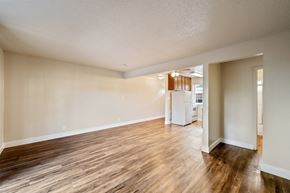 Concord apartment for rent - A room with wooden flooring and white walls.
