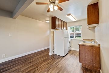Concord apartment for rent - A kitchen with a white refrigerator and wooden floors.