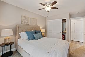 Fremont apartment for rent - A bedroom with a large bed and a ceiling fan.