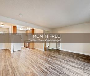 Concord apartment for rent - a kitchen and living room with hardwood floors and a white refrigerator