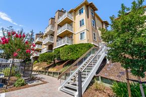 Castro Valley apartment for rent - A multi-story residential building with a staircase leading to the entrance.