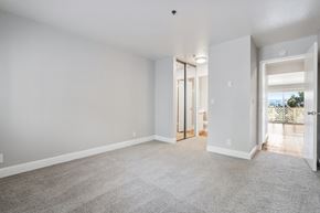 Castro Valley apartment for rent - A spacious room with a carpeted floor and white walls.