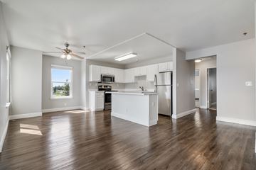 Castro Valley apartment for rent - A spacious kitchen with white cabinets and stainless steel appliances.