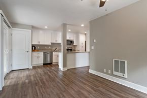 Castro Valley apartment for rent - A kitchen with white cabinets and a stainless steel dishwasher.