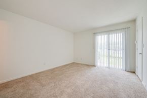Portsmouth apartment for rent - an empty living room with a sliding glass door