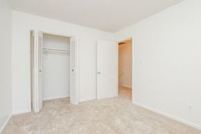 Chesapeake apartment for rent - a bedroom with a closet and a hallway with closet doors