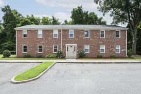 Portsmouth apartment for rent - the front of a brick building with a white door