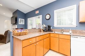 Mechanicsville apartment for rent - a kitchen with blue walls and a counter top with a sink