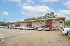 Norfolk apartment for rent - a large brick building with cars parked in front of it