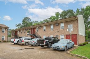 Norfolk apartment for rent - a brick apartment building with cars parked in front