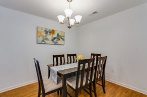 Richmond apartment for rent - A dining room with a table set for four.