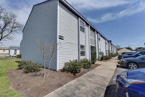 Norfolk apartment for rent - a white building with cars parked in front of it