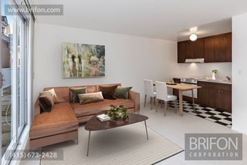 San Francisco apartment for rent - a living room with a couch and a table and a kitchen