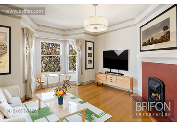 San Francisco apartment for rent - an image of a living room with a fireplace and a tv