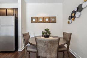 Suffolk apartment for rent - a dining room with a table and chairs and a refrigerator at Hampton Roads Crossing, Suffolk, 23435