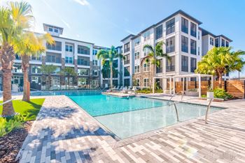 Resort-style pool with expansive sundeck and tanning shelf.