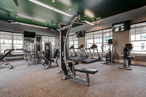 Burleson apartment for rent - a large fitness room with treadmills and other exercise equipment