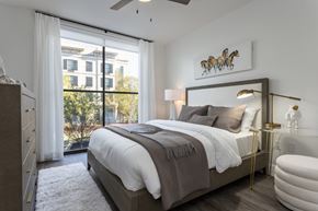 Huntsville apartment for rent - Modern bedroom with platform bed and natural lighting at 2020 Providence Apartments, Alabama, 35806