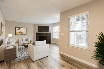 Greenville apartment for rent - A living room with a fireplace and a painting on the wall.