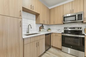 Kissimmee apartment for rent - Modern Kitchen with Subway Tile Backsplash and Gooseneck Pulldown Sprayer at Tapestry Headwaters in Kissimmee, FL
