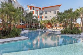 Kissimmee apartment for rent - Swimming Pool with Seating and Umbrellas at Tapestry Headwaters in Kissimmee, FL