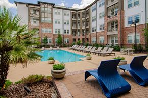 Baton Rouge apartment for rent - our apartments offer a swimming pool with lounge chairs