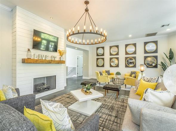 Birmingham apartment for rent - a living room with a fireplace and a chandelier
