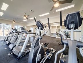 Hoover apartment for rent - a gym with various cardio machines and weights