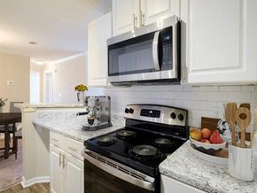 Hoover apartment for rent - a kitchen with a stove and a microwave