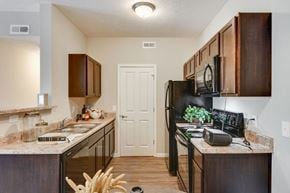 Columbus apartment for rent - Black Appliances in Kitchen at Austin Place Apartments