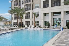 Sarasota apartment for rent - a large pool with sundeck, chaise lounges at Tapestry University Park Apartments in Sarasota, FL