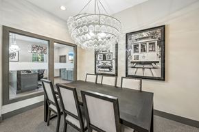 Columbus apartment for rent - A dining room with a table and chairs and a chandelier.