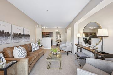 Columbus apartment for rent - A living room with a brown couch and a coffee table.