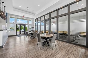 Columbus apartment for rent - A modern dining room with a large table and chairs.