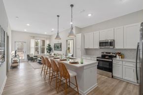 Orange Beach apartment for rent - A modern kitchen with a dining table and chairs.