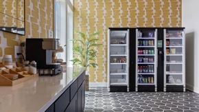 Homewood apartment for rent - A kitchen with a black counter top and a yellow and white tiled wall.