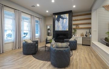 Covington apartment for rent - a living room with couches and chairs and a fireplace
