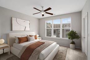 Daphne apartment for rent - A bedroom with a large bed and a ceiling fan.