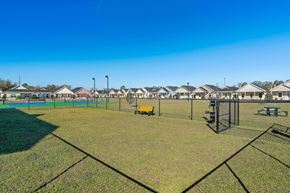 Foley apartment for rent - A park with a playground and a fence.
