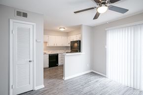Little Rock apartment for rent - Living Area With Kitchen View at Arbor Pointe at Hillcrest, Little Rock, Arkansas