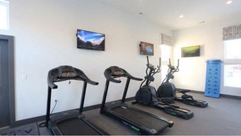Onsite 24-hour fitness center with free weights
