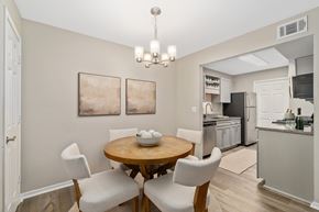 Biloxi apartment for rent - A dining room with a table set for two.