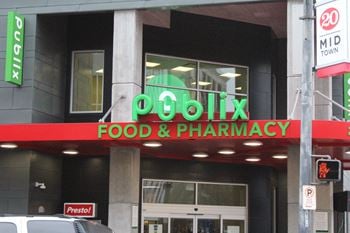 The sign for the podiatric food and pharmacy on the side of a building