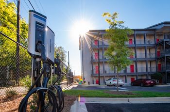 Gated, secure parking with electric car charging stations