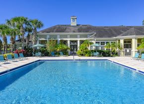 Port Orange apartment for rent - a large swimming pool in front of a house