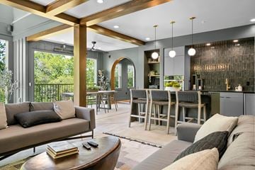 Spartanburg apartment for rent - A modern living room with a large couch and a coffee table.