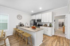 Huntsville apartment for rent - Open floor plan with island kitchen and white cabinets at Cottages at Oak Grove Dairy in Huntsville, AL