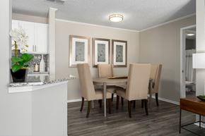 Hoover apartment for rent - A dining room with wood-look flooring at Summerchase at Riverchase in Hoover, AL